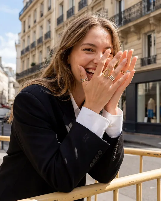 Woman wearing jewellery in a candid city moment